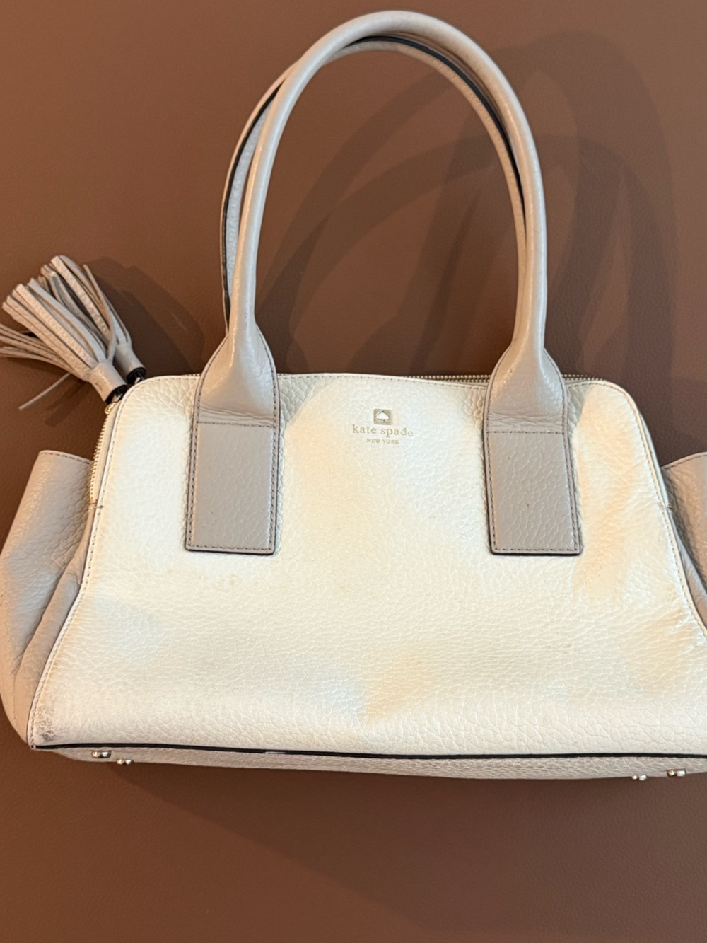 kate spade Cream Pebbled Leather Tote with Tassel
